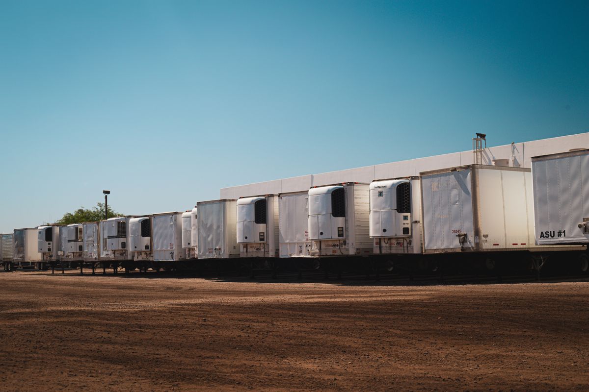 Refrigerated trucks parked at a distribution yard